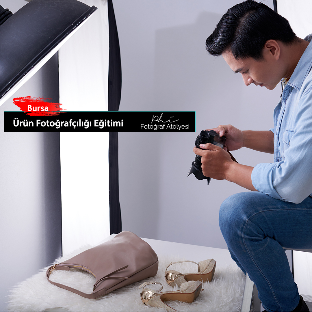 Young Vietnamese man taking photos of fashion items in studio